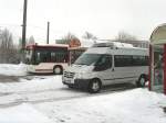 bus/50314/kleinbus-im-auftrag-der-evag-und Kleinbus im Auftrag der EVAG und Stadtbus in der Umsteigehaltestelle Grubenstrasse, Erfurt 3.1.2010